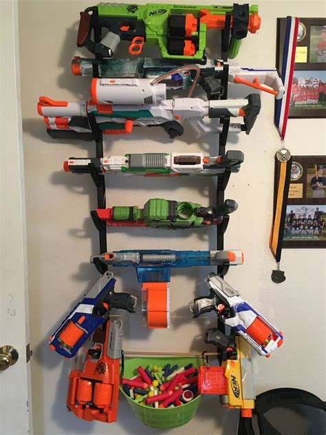 Unused waste bins make great storage hang the each nerf gun over the coat rack hooks by its trigger and shut the cabinet until you need them.8. Pin on Nerf guns