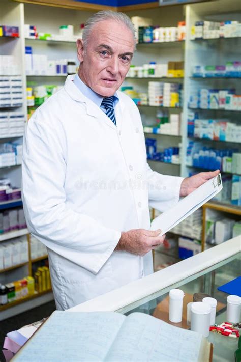 Pharmacist Holding A Clipboard In Pharmacy Stock Image Image Of