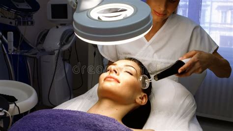 Doctor Performing Laser Hair Removal On Patient Skin Stock Video