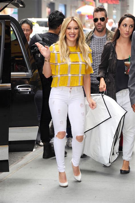 Hilary Duff Seen Out Wearing A Yellow And Silver Fringe Top With White