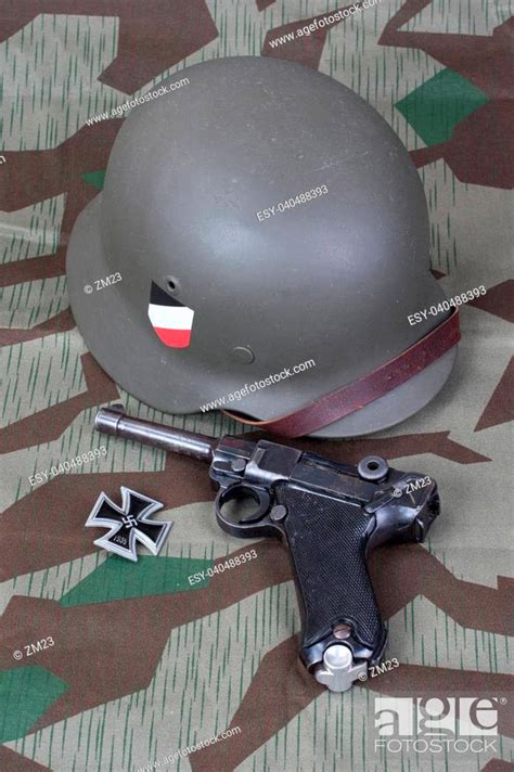 Luger P08 Parabellum Handgun Helm And Medal Iron Cross On Camouflaged