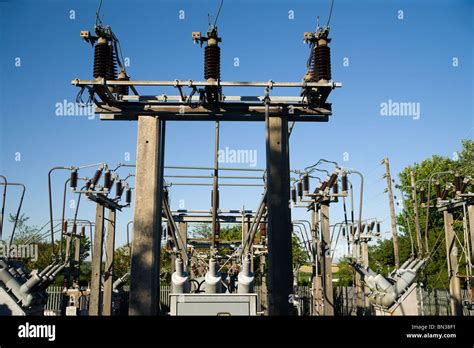 High Voltage Substation On Blue Sky Background With Switch And