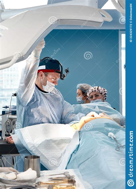 Team Surgeon At Work In Operating Room Stock Photo Image Of Surgery