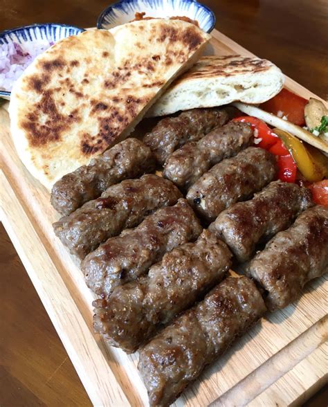 Download Authentic Grilled Ćevapi With Pita Bread Wallpaper