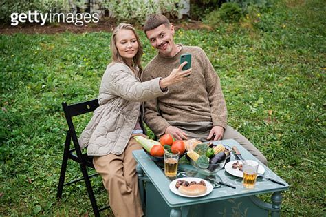Newlyweds Fool Around At A Picnic In The Backyard Take A Selfie On