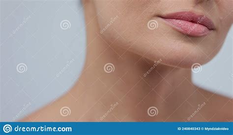 Close Up Beauty Portrait Of Young Woman Softly Touches Her Chin With A