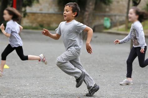 Children Hopping On One Foot