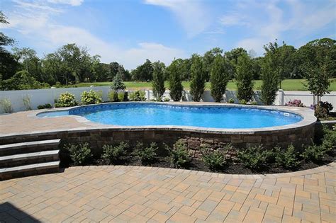 We offer a wide range of custom swimming pool designs in a huge array of styles and shapes. Radiant 18x32 Semi-Inground Freeform with walk-in steps ...