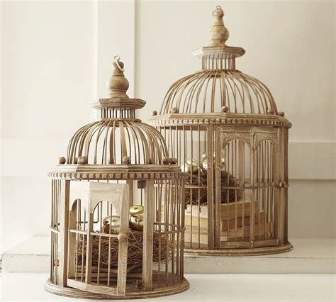 Birdcages make great containers to display flower arrangements. Decorative bird cages in the interior, romantic decor ...