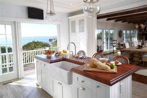 If you too are redesigning your kitchen, the kitchen corners might be on your mind already. White Island With Wood Countertop in Beach House Kitchen ...