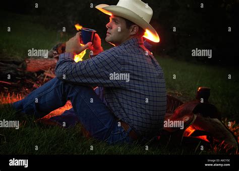 Cowboy Near Campfire Stock Photo Alamy