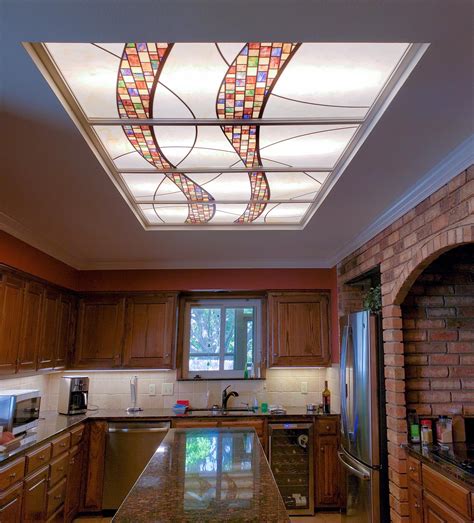 The fluorescent fixtures are recessed into the ceiling with plastic covers that the light shines through. Stained Glass Light Panels: How to Enhance Any Space With ...