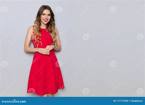Smiling Elegant Young Woman In Red Dress Stock Photo Image Of Gray