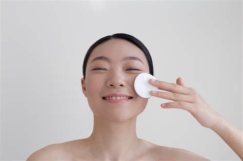 Free Photo Beautiful Asian Woman Posing With Facial Cream
