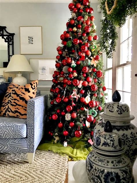 A Decorated Christmas Tree In A Living Room Next To A Blue And White