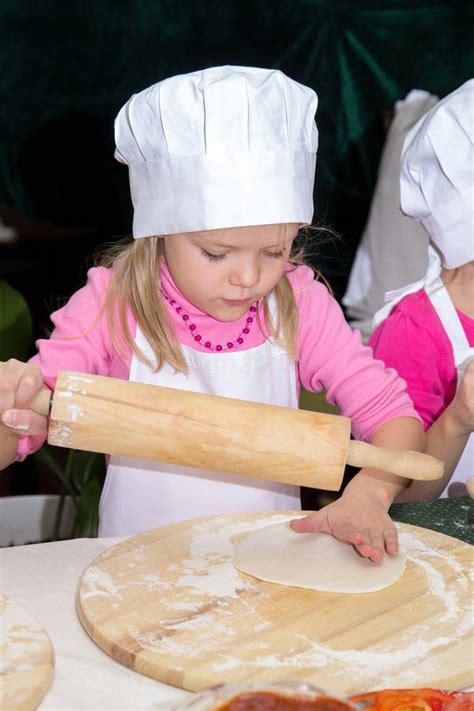 Little Girl In Chefs Hat Is Cooking Pizza Stock Photo Image Of Master