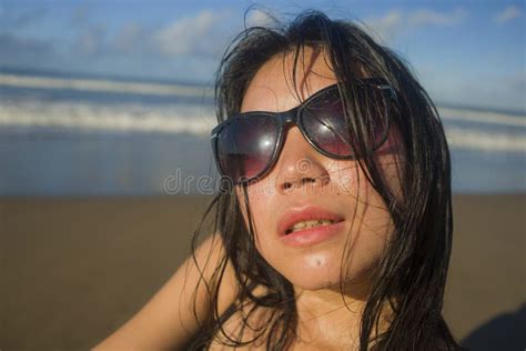 Natural Lifestyle Portrait Of Young And Cool Asian Chinese Woman In Swimsuit And Sunglasses On