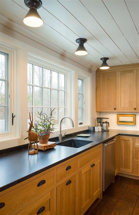 At the time it was built, we opted for standard raised panel oak cabinets instead of upgrading to maple or cherry. black granite countertops with oak cabinets - Google ...