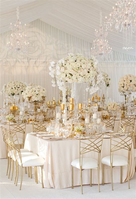 Covered With Soft Blush Linens And Lush Arrangements Of Ivory Florals