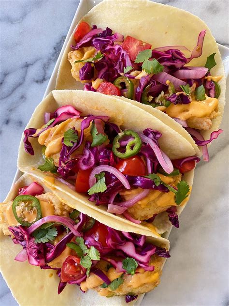Crispy Fish Tacos With Fresh Cabbage Slaw And Sriracha Aioli