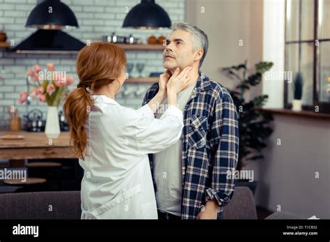 Professional Female Doctor Touching Her Patients Neck Stock Photo Alamy