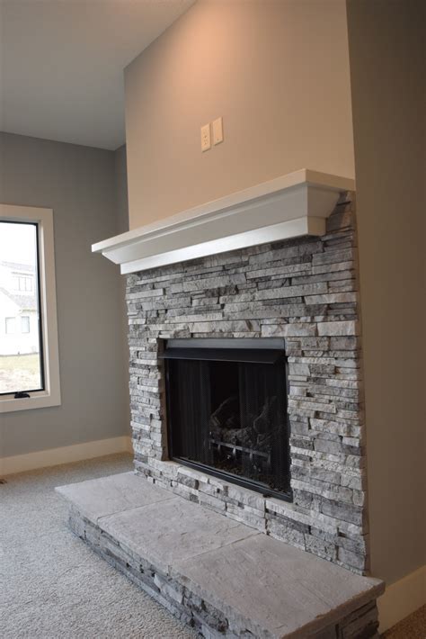 Stacked stone fireplaces allows us to bring comfort and cozyness into decors and spaces that would otherwise feel bland. Fireplace Mantle and Fireplace Surround Options | Lancia Homes