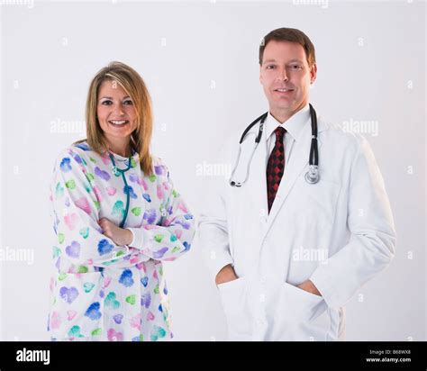Male Doctor And Female Nurse With Stethoscopes Portrait Stock Photo