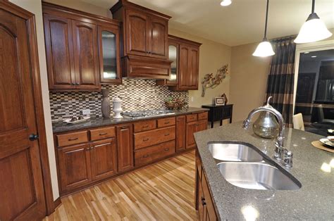 Gray tones are used predominantly in this modern kitchen. 15532.2012.WCI Cherry - Hazelnut Cabinets Maple #3 | Cabinet, Home decor, Kitchen