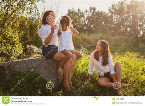 Mom Combs Her Daughter`s Hair In Nature Stock Image Image Of Adult