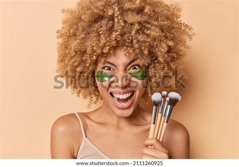 Outraged Curly Haired Young Woman Screams Stock Photo 2111260925
