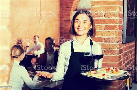 Female Waiter In Country Restaurant Stock Photo Download Image Now