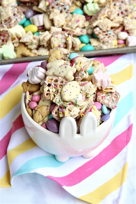 A White Bowl Filled With Cookies And Candy