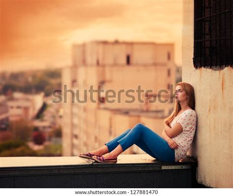 Beautiful Young Girl Sitting On Roof Stock Photo Edit Now 127881470