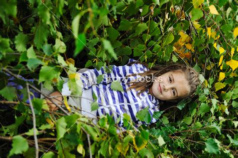 Beauty Blond Girl Laying Down On Leaves Ground Royalty Free Stock Image