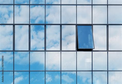 Open Glass Window With Reflection Sky On High Rise Building Stock Photo
