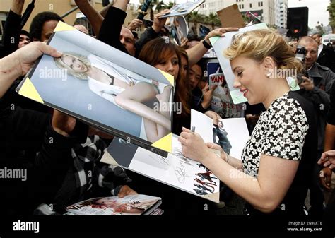 Actress Scarlett Johansson Signs Autographs For Fans After Receiving A