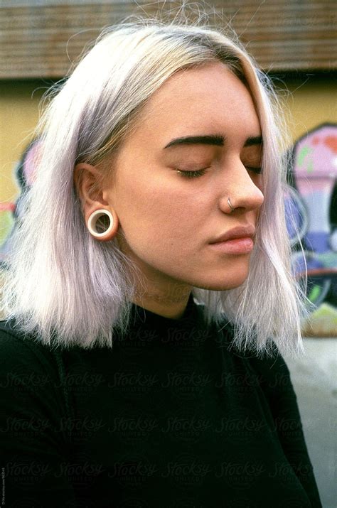 Young Blonde Woman With Piercings And Closed Eyes By Di Na Portrait