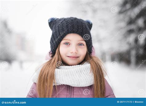 Beautiful Little Girl Five Years Old Portrait In A Snowy City Park