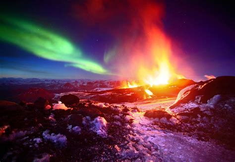 Icelandic Volcano Fimmvörðuháls Erupts Against Aurora Borealis