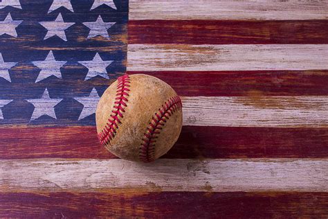 Old Baseball On American Flag Photograph By Garry Gay