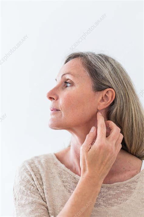 Woman Scratching Her Neck Stock Image C0346729 Science Photo Library