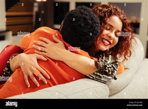 Thankful Happy Wife Hugging Her Loving Man After Amazing Surprise Stock