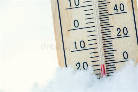 Thermometer On Snow Shows Low Temperatures Under Zero Low Tempe Stock
