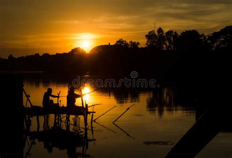 Two Fisherman Silhouette Against Sunset Stock Image Image Of Nature