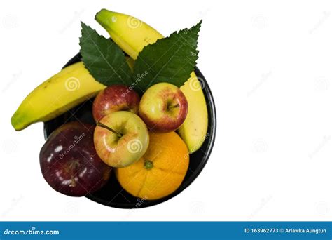 Fresh Fruit On A Black Tray With Bananas Apples And Navel Oranges