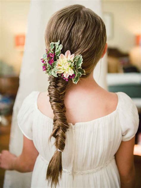 Aurora's hair was twisted back into a very elegant ring around the crown of her head. 14 Adorable Flower Girl Hairstyles