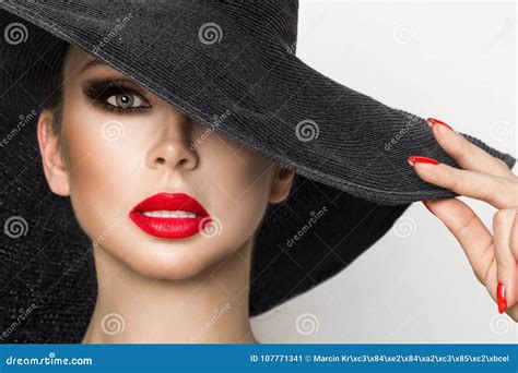 portrait of an elegant woman in a hat and red lips on a white background stock image image of