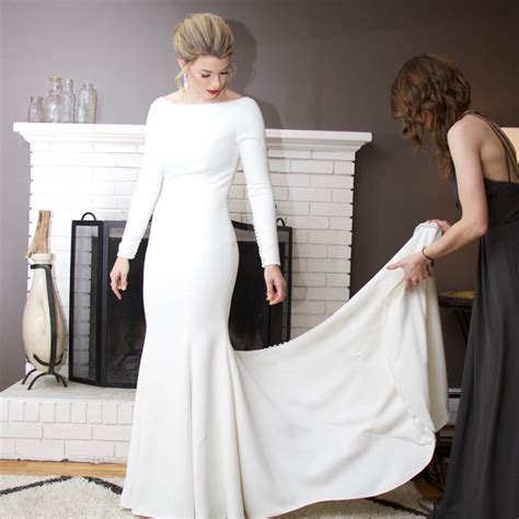 Gorgeous White Mermaid Satin Long Sleeve Crystal Beaded Wedding Dress