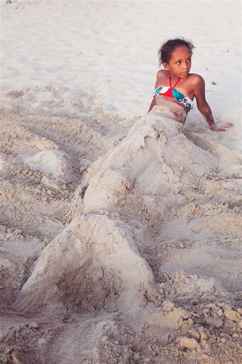 Young Girl With A Mermaid Tail Made Out Of Sand Del Colaborador De Stocksy Anya Brewley