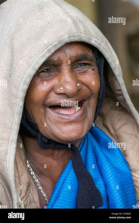 Portrait Of An Old Toothless Woman Laughing At A Foodstall Near Munnar